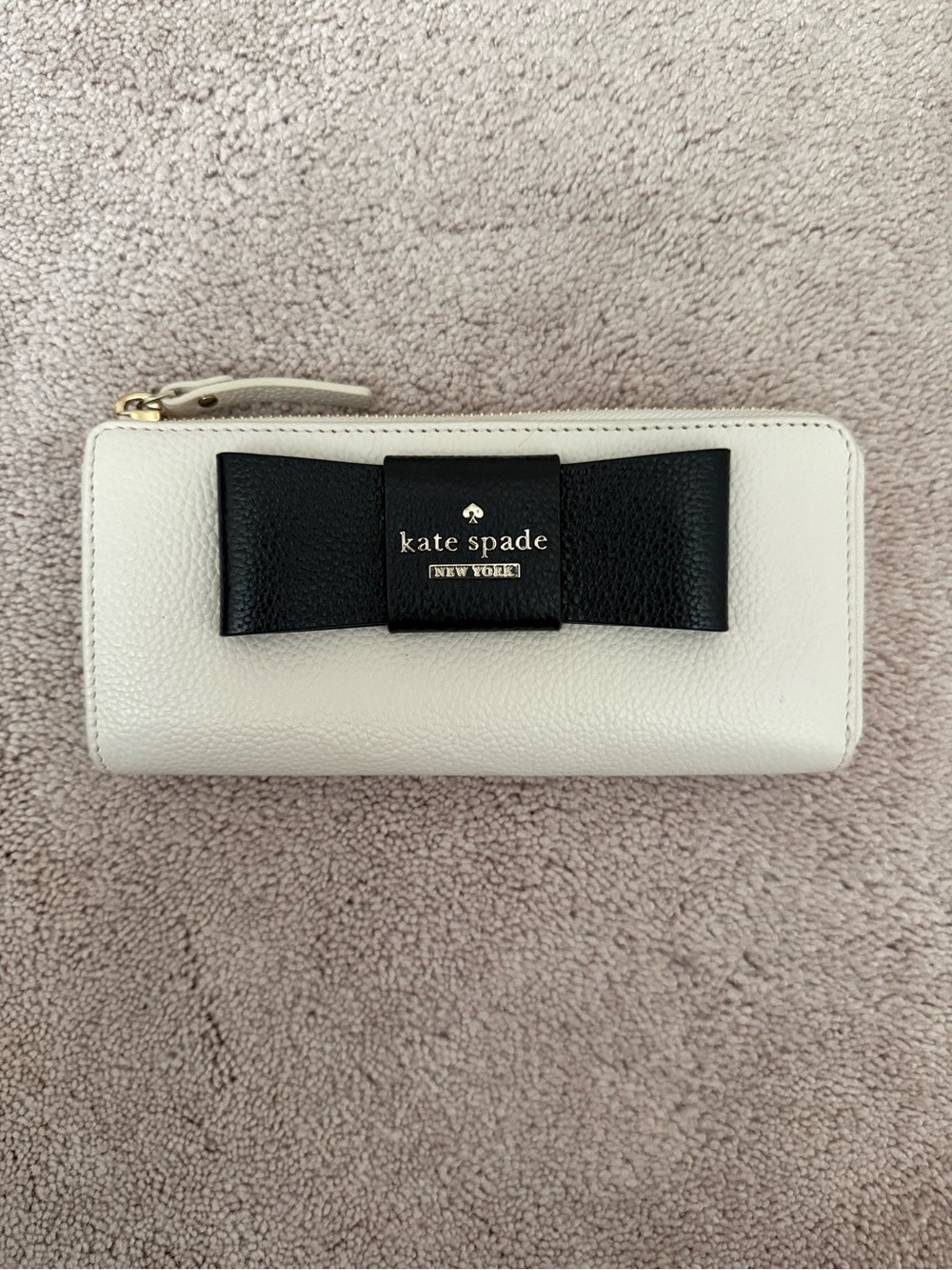 kate spade White Leather Zip Wallet with Black Bow Accent